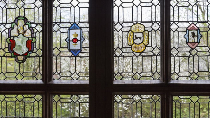Stained glass crests in the Great Parlour at Little Moreton Hall, Cheshire